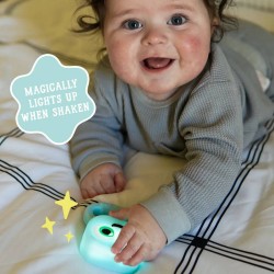 Bébé jouant avec le hochet lumineux Blair pour développer sa préhension et sa motricité fine